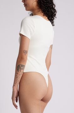 Create chic tucked-in looks with this seamless, T-shirt–style bodysuit made from buttery-soft, subtly lustrous rib. Jewel neck Short sleeves Lined, except sleeves 94% nylon, 6% spandex Machine wash, line dry Imported White Short Sleeve Trendy Bodysuit, Sleek Fitted Bodysuit For Summer, Sleek Bodycon Bodysuit For Summer, Chic Short Sleeve Fitted Bodysuit For Summer, White High Stretch Short Sleeve Bodysuit For Summer, Sleek Stretch Bodysuit For Spring, Sleek High Stretch Bodysuit For Spring, Sleek High Stretch Spring Bodysuit, White Fitted Short Sleeve Bodysuit For Summer