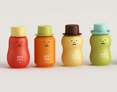 the bottles have faces drawn on them in different colors