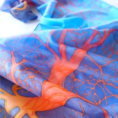 Silk scarf Orange Tree in Blue is a hand painted scarves made of pure Habotai silk and painted with fiery tree silhouette on deep blue sky. This scarf isa lovely graduation gift. It is made to order and I will need up to 3 days for painting. The Fiery Trees symbolize strength and knowledge. I designed this scarf with strong opposite color set: red - orange - yellow with cool blue background creating a contrast scarf, an eye-chatcher and a perfect statement piece of wearable art. This scarf is ap Artistic Blue Silk Scarf, Blue Hand Painted Silk Scarf, Artistic Hand Dyed Blue Silk Scarf, Artistic Blue Silk Scarves, Artsy Blue Scarf As Gift, Artsy Blue Scarf As A Gift, Artsy Blue Scarf For Gift, Artsy Blue Scarf Perfect As A Gift, Artsy Blue Scarves As Gifts