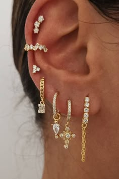 A woman wearing multiple ear piercings. Ear Cuff Gold, Multiple Ear Piercing, Minimalist Earring, Earring Trends, Ear Stack