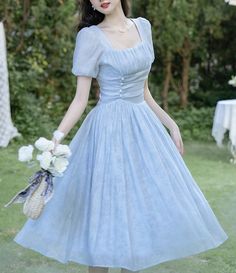 Slip into this truly exquisite 1950s vintage reproduction Edith pale sky blue dress and feel like the belle of the ball. Crafted with meticulous attention to detail, this light and airy piece with ruched details, accented waist, and voluminous skirt is sure to captivate. Perfect for any special occasions, it will lend a touch of timeless elegance to your vintage style wardrobe. Dress Biru, Blue Vintage Dress, Blue Dress Outfits, Vintage Dress Blue, Sky Blue Dress, Baby Blue Dresses, Light Blue Dresses, Korean Dress, Vintage Style Dresses