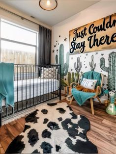 a baby's room with cactus themed decor