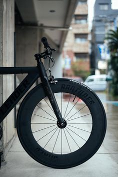 a bicycle parked on the side of a building