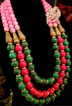 This gorgeous triple strand beaded statement necklace features green malachite, red magnesite and pink glass beads along with Tibetan Brass Repousse teardrops. Each bead beneath the Tibetan brass is spaced with an aurora borealis rhinestone rondelle. Non-adjustable 30" with a fancy silver tone, art nouveau hook clasp. I would assess this bold and chunky piece to be of moderate weight. The first photographs shows it with a 4" x 2" rhinestone jewel, which is detachable. You can see it styled witho Green Gemstone Beaded Necklaces In Temple Jewelry Style, Green Gemstone Beads Temple Jewelry Necklace, Temple Jewelry Green Gemstone Beaded Necklaces, Traditional Green Malachite Jewelry, Tone Art, Jewellery Shop Design, Turquoise Western, Statement Bib Necklace, Chest Piece