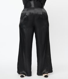 These luxurious plus size pants are crafted in a fabulous black satin. The high waisted silhouette is secured with a back zipper, while the wide legs are outfitted with side pockets! Available in sizes XS-5X while supplies last Black High Waisted Pants, Uv Clothing, Vintage Inspired Fashion, Plus Size Pants, Vintage Branding, Model Pictures, Black Satin, High Waisted Pants, Satin Dresses