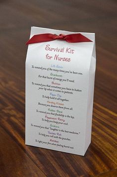 a survival kit for healthcare caregivers on a wooden table with a red ribbon