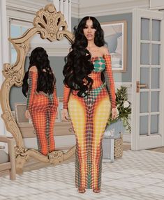 a woman standing in front of a mirror wearing an orange and yellow patterned bodysuit