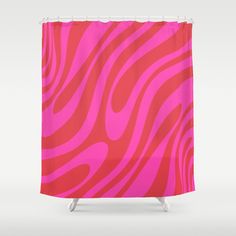 a pink and red shower curtain with wavy lines