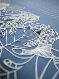 an intricately designed blue paper with white lines