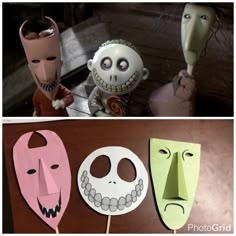 three different masks with faces on them, one is made out of paper and the other has