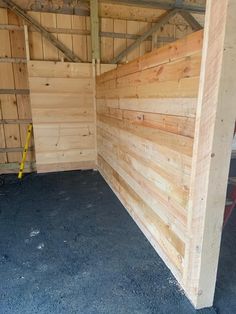 the inside of a wooden building with blue carpet