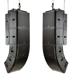 two large speakers hanging from chains on the side of each speaker, one in front of the other