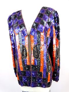 "This is a stunning statement piece! This evening jacket is fully embellished with sequins all over in a retro design. It's in excellent condition! Bust - 40\" (there is 1 hook closure) Shoulders - 16\" Sleeves - 24\" Top to Bottom - 27\" All of my items come from a smoke-free and pet-free home. If you have any questions, please don't hesitate to ask!" Vintage Sequin Jacket, Checkered Jacket, Evening Jacket, Cardigan Vintage, Mardi Gras Party, Sequin Jacket, Evening Jackets, Beaded Gown, Embellished Dress