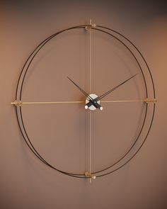 a clock that is on the wall with some wires attached to it's sides