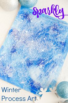 winter process art project for kids to make sparky paper snowflakes and ornaments