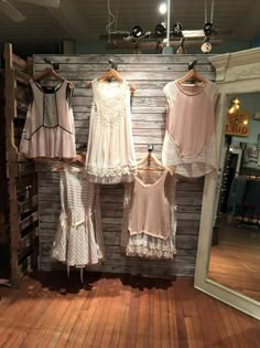 two women's dresses hanging in front of a store window with the caption best 25 clothing displays ideas on pinterest i display ideas, diy