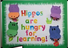 there is a sign that says hippos are hungry for learning on the wall