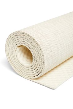 a roll of white fabric on a white background