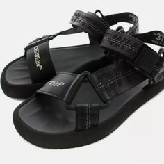 All Black Brand New Size 36 Summer Flat Heel Sandals For Streetwear, Flat Heel Sandals For Summer Streetwear, Modern Black Sport Sandals For Summer, Modern Black Sport Sandals For Vacation, Modern Black Sandals For Vacation, Modern Black Sport Sandals With Ankle Strap, Modern Black Ankle Strap Sport Sandals, Off White Shoes, Shoes Brand