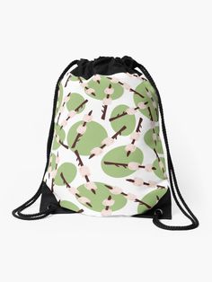 a green and white bag with trees on the front, black drawstring straps