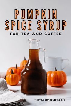 pumpkin spice syrup for tea and coffee on a white table with small pumpkins in the background