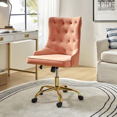 a pink office chair sitting on top of a white rug in front of a window