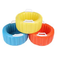 three different colored plastic containers with lids