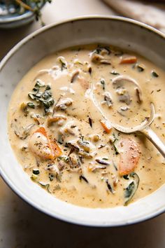 a white bowl filled with soup on top of a table