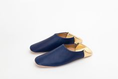 (1) Women's Indigo Blue & Gold Leather Slippers | House Shoes | Jill Burrows Luxury Blue Round Toe Slip-ons, Luxury Blue Slip-ons With Rubber Sole, Luxury Blue Leather Slides, Luxury Chic Closed Toe Slippers, Wandler Rosa Leather Slippers, Luxury Blue Slip-on Flats, Luxury Leather Sole Slippers For Galas, Luxury Leather Sole Closed Toe Slippers, Classic Luxury Leather Slippers