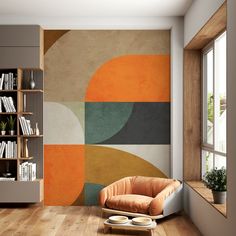 an orange chair sitting in front of a book shelf on top of a hard wood floor