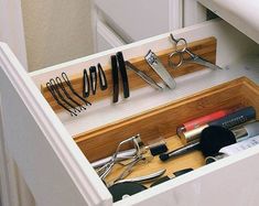 a drawer with scissors and other tools in it