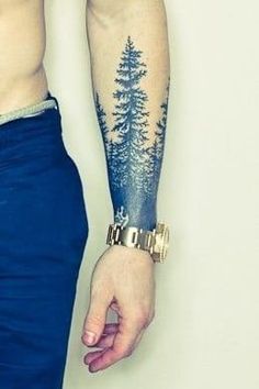 a man's arm with a pine tree tattoo on the left side of his body