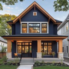 a blue house with lots of windows on the front