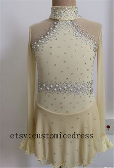 an image of a woman's figure skating outfit with pearls and sequins