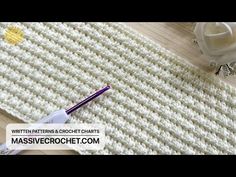 the crochet pattern is being used to make a place mat for a flower