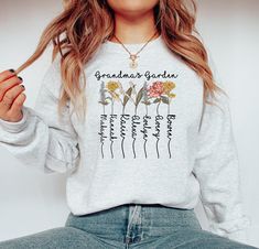 Gildan 1800 Grandma's Garden, Mom's Garden, Nana's Garden with Kid's Names crewneck sweatshirt sweater, high quality UV Ink prints! We advise machine washing with cold water and hanging to dry for longevity. Size up for an oversized look!  WHY SHOP MOODY?! 🌸 All of our designs are uniquely curated, designed, and made in our warehouse.  📦 Each of our orders are inspected for 100% accuracy, are packed securely, and shipped within 1-3 business days.  💕 We're here for you! We offer support 7 days Grandma Sweater, Grandma's Garden, Flower Sweatshirt, Grandmas Garden, Oversized Look, Garden Gift, Gift For Grandma, Gift For Mother, Birth Flower