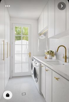 a washer and dryer in a white laundry room