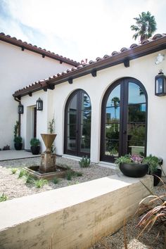 a white house with black doors and windows