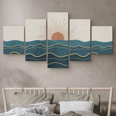 the sun is setting over the ocean with waves on it's sides in this modern bedroom