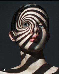 a woman's face is shown with the shadows on her body