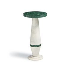 a white and green marble pedestal on a white background with an oval top in the center