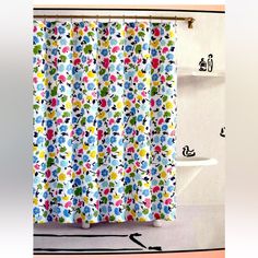 a colorful shower curtain in a bathroom