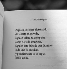 an open book with some writing on the pages and one in spanish is black and white