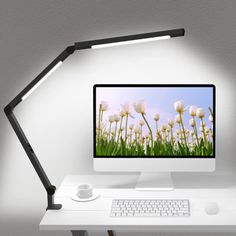 a computer monitor sitting on top of a white desk