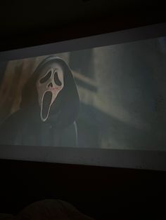 a screen with a scary mask on it