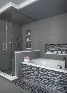 a large bathroom with a walk in shower next to a bathtub