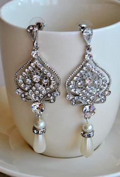 "Chandelier Bridal Earrings, Vintage Wedding Earrings, Pearl Drops, Art Deco Bridal Jewelry BETTANIE Vintage Elegant glamour traditional wedding crystal earrings with top quality cubic zirconia and ivory pearls to create amazing sparkle. They sparkle from every direction! A perfect addition to any occasion. Beautiful earrings made from Cubic Zirconia detailed posts with ivory dangle pearls tear drops and surrounded by tiny cubic zirconia crystals. Made for pierced ears. These earrings are 2\" lo Vintage Wedding Earrings, Wedding Earrings Vintage, Long Bridal Earrings, Wedding Jewelery, Pearl Chandelier Earrings, Bridal Earrings Chandelier, Crystal Earrings Wedding, Crystal Bridal Earrings, Pearls Earrings