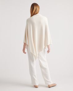 We love when an outfit comes together so easily. This baby-soft cashmere poncho adds some low-key luxe to your fave denim, leggings, and more. It all starts with 100% grade-A Mongolian cashmere, sourced sustainably and ethically from Inner Mongolia's Hircus goats. Layer up with three times the warmth of wool and quality that's made to last. Read more on what makes it special in our Cashmere 101.  | Quince | Women's Mongolian Cashmere Poncho in Ivory Chic Oversized Cashmere Cape, Chic Cashmere Poncho For Layering, Chic White Cape For Spring, Chic White Poncho For Fall, Chic White Fall Poncho, Chic White Cape For Fall, Cozy White Cape For Fall, 100 Grade, Contemporary Wardrobe