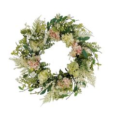 a wreath with white flowers and green leaves