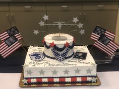 a cake decorated with an american flag and two flags